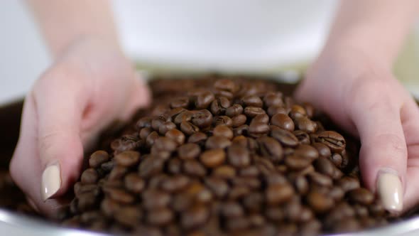 Unrecognizable Woman Taking Handful of Fresh Coffee Beans