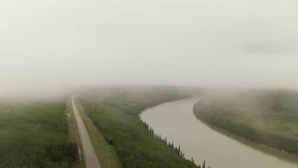 Beautiful View of Winding River Alongside Scenic Road