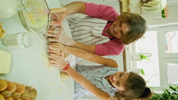 Grandmother and Child Cook Dough Together