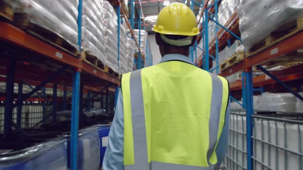 Male worker walking in a warehouse