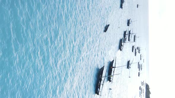 Tanzania Vertical Video  Boat Boats in the Ocean Near the Coast of Zanzibar Aerial View