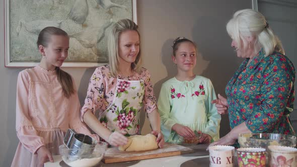 Happy Family Preparing Dough for Baking on Home Kitchen