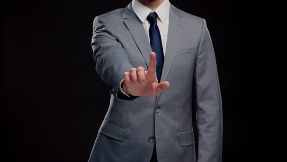 Studio portrait of successful and smart businessman in suit and tie.