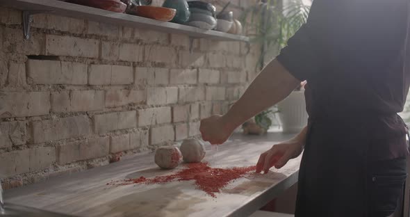 Ceramist mixes dye for kneading colored clay,