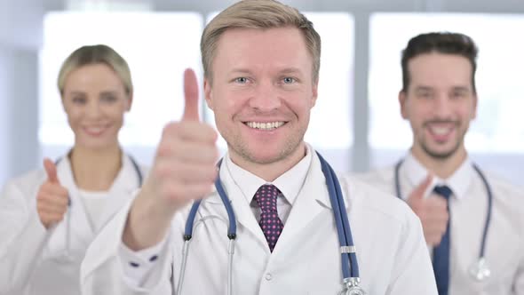 Portrait of Professional Team of Doctors Doing Thumbs Up