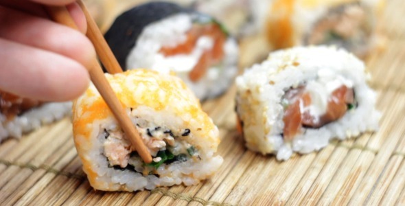 Eating Japanese Sushi Rolls
