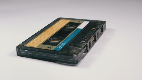 Vintage Audio Cassette Rotates on White Background