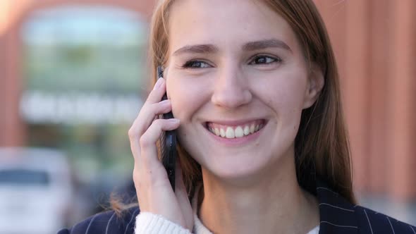 Happy Young Beautiful Woman Talking on Phone