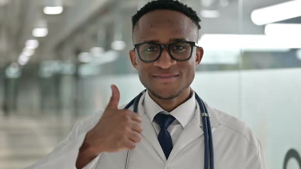 Portrait of Young Male African Doctor Showing Thumbs Up