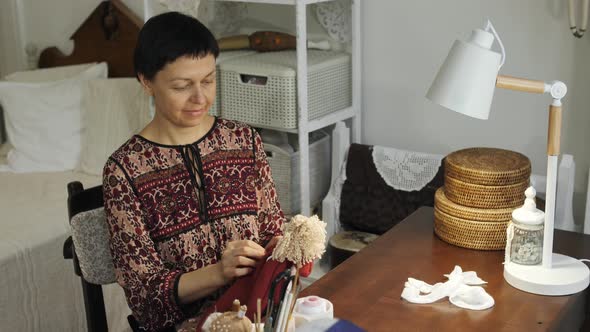 Woman looking pleased about her rag doll