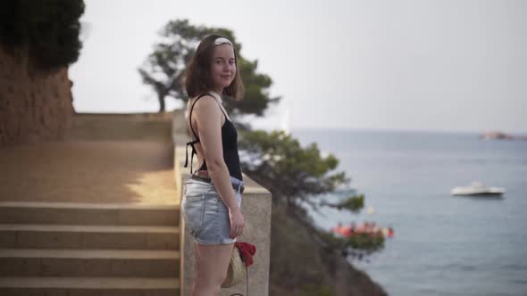 Young female model in the heavenly part of the island Costa Brava in Catalonia.