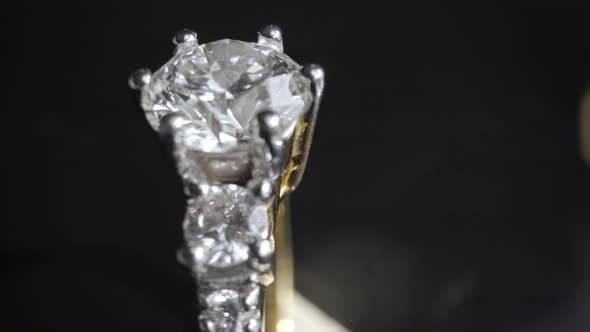 Extreme Detailed of Diamond Ring Close Up Shot While Rotating on Dark Background