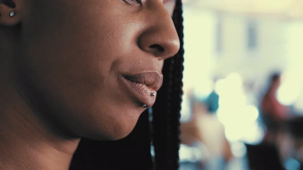 break, relax - young south american woman drinks an espresso-close up