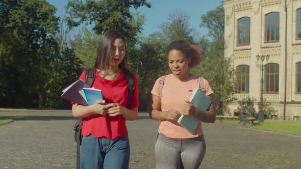 Multiethnic Female Students Walking on Campus