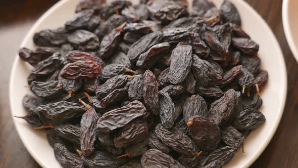 Dry Raisins in a White Plate