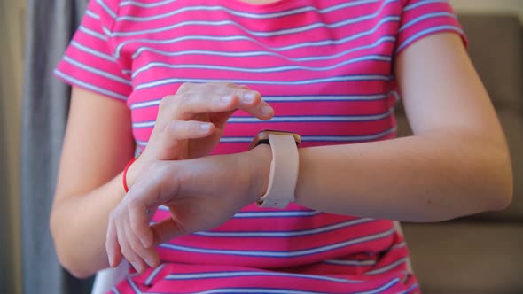 Woman browsing smart wrist watches in closeup 4k video