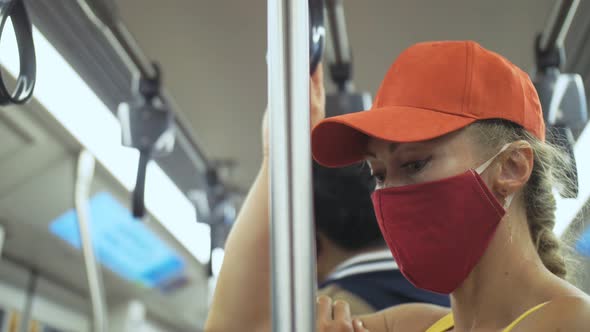 Woman Travel Caucasian Ride at Overground Train Airtrain with Wearing Protective Medical Mask
