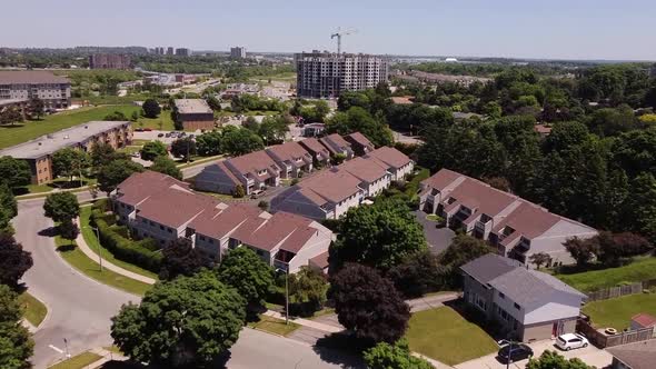 Aerial over suburban housing in summer.