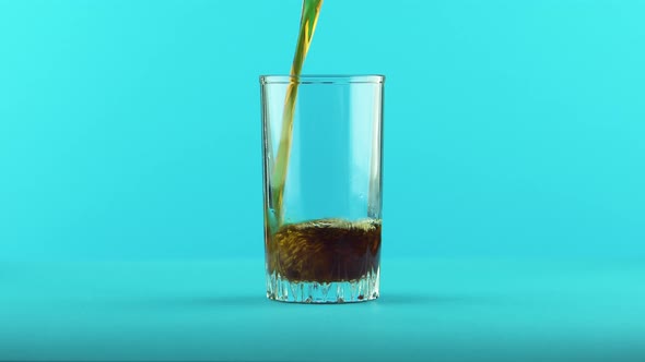 Fizzy Cola Soda Cold Beverage Drink Pooring Into Threaded Glass Blue 