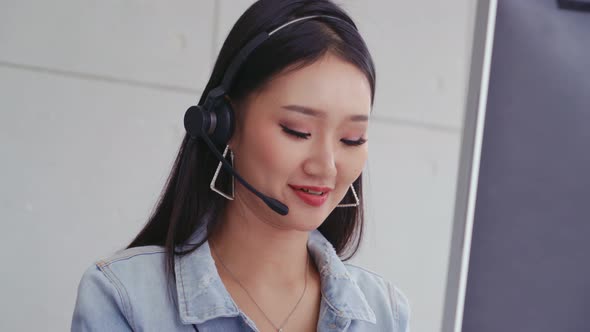 Customer Support Agent or Call Center with Headset Talking to Customer on Phone