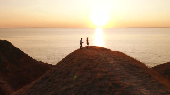 Couple in love.Traveler-bloggers walk in mountain.