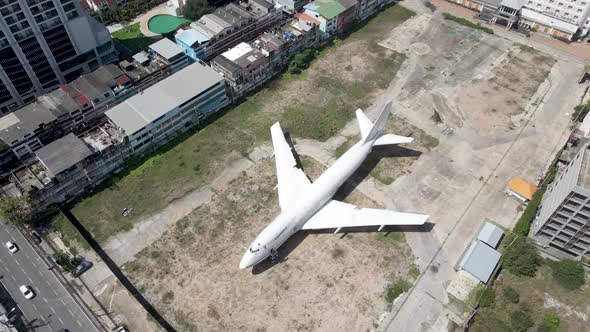 Topdown view Discarded Jumbo jet on Pattaya Downtown, Street food Project Concept.