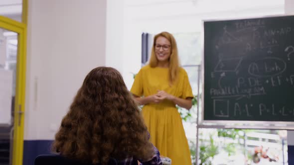 Lesson in School Girl Wants to Answer the Question By Raising a Hand