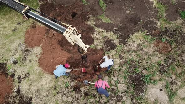 Drilling Rig Machine Drills the Ground. Workers on Construction Holes Boring for Piles 