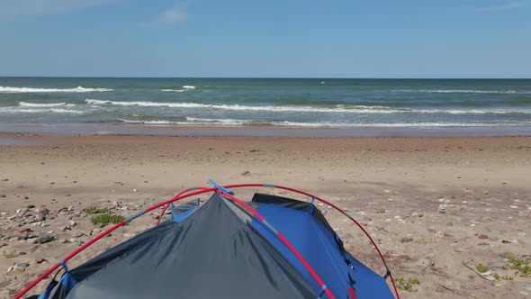 Drone Flies Above Tent Placed at Beach Near Baltic Sea and Reveals Horizon