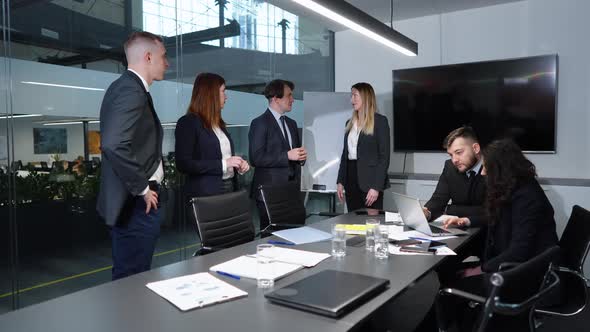 Group of Business People Having Discussion in Office