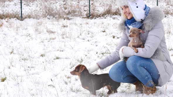 Woman with Dogs Outside, Winter