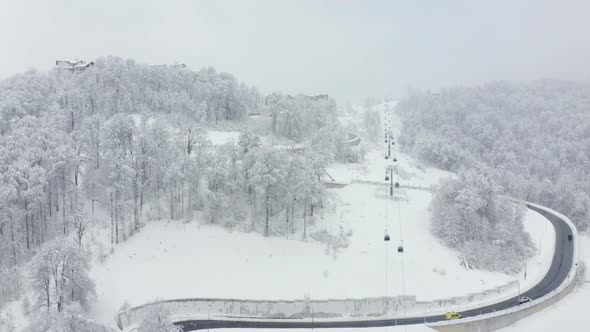 Slowly Flight Famous Ski Resort Rosa Khutor Olympic Village with Funicular and Serpentine Highway