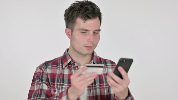 Portrait of Young Man with Successful Online Shopping on Smartphone