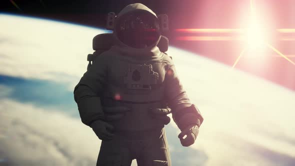Space Man Astronaut in Space on a Background of the Blue Planet Earth alt
