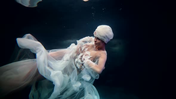 Sea Fairy is Floating Underwater Slow Motion Subaquatic Shot with Stunning Lady in White Gown