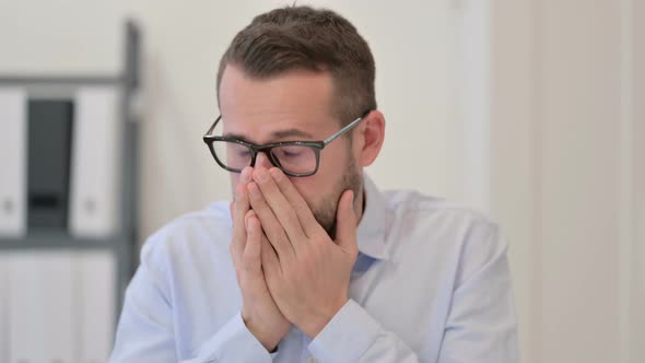 Portrait of Middle Aged Man Sneezing