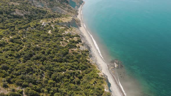 Aerial View of Beach, a Tropical Forest and Ocean with Waves. Azure Beach with Rocky Mountains and