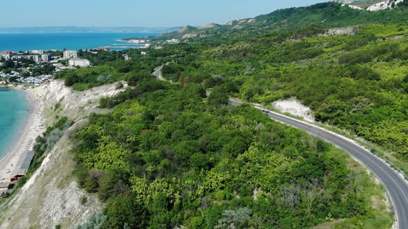 Vehicle Driving On Coastal Road In The Hill At The Coast Of Heros Beach In Balchik, Bulgaria With Sc