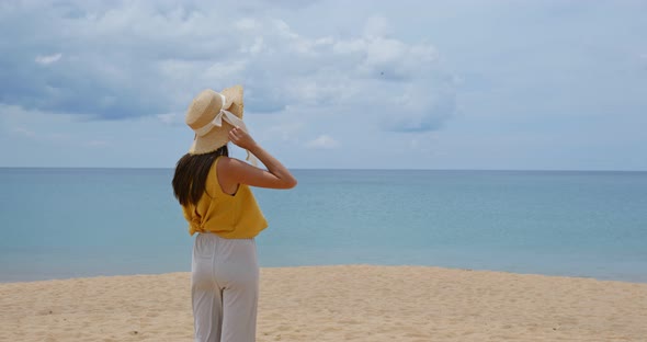 Woman look at the sea on beach