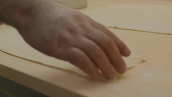 Male Chef Working on Baklava Dough