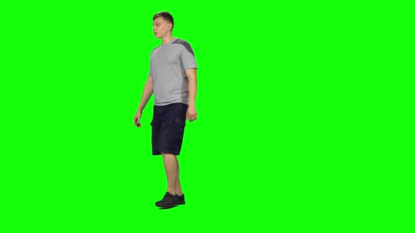 Male Goes and Dances, Smiles and Rejoices on a Green Screen, Chroma Key