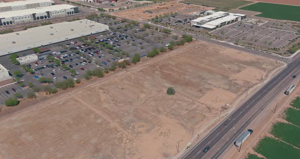 Aerial view of logistics center next to the highway in the field near the road