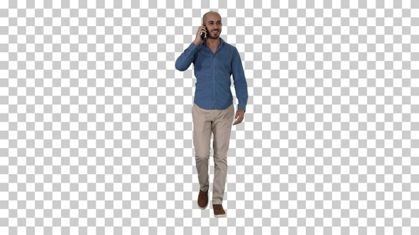 Young arab man walking and talking on the phone and smile Alpha