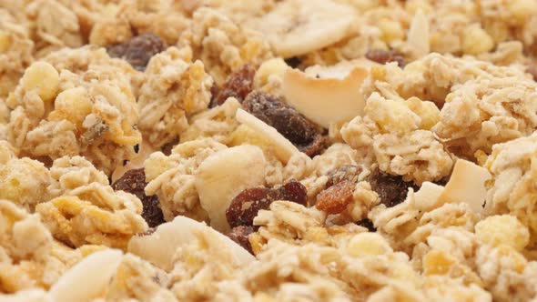 Crunch muesli food background close-up slow tilt 4K 3840X2160 UltraHD footage - Cereals and dried fo