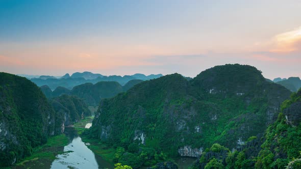 Sunset time lapse aerial view of Ninh Binh region, Trang An Tam Coc tourist attraction Vietnam