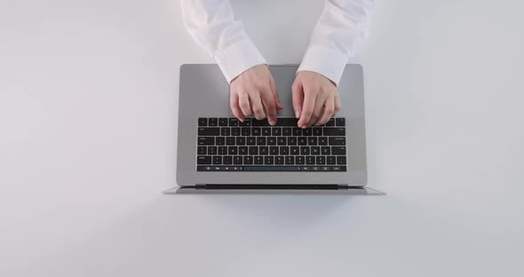 Woman Typing on Laptop