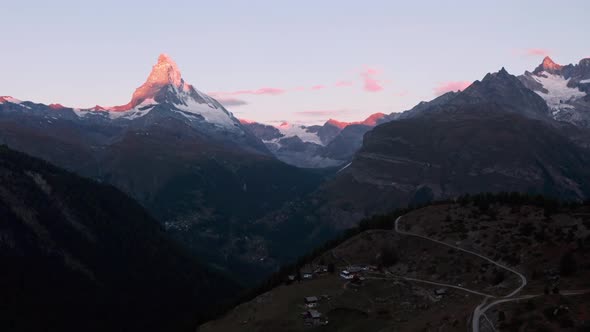 Dolly forward drone shot of the Matterhorn Switzerland at dawn Alpenglow