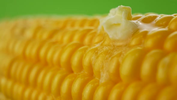 Piece of Butter Melts on Hot Corn