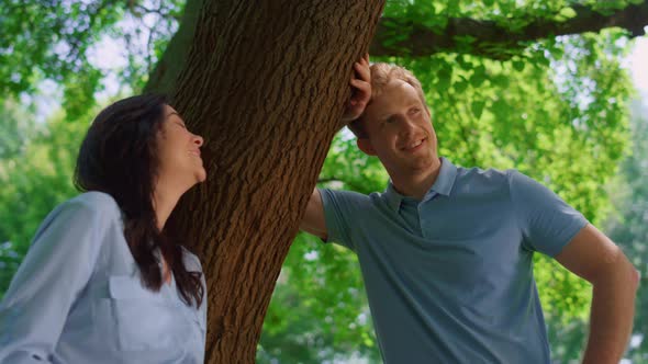 Smiling Pair Standing on Nature Closeup