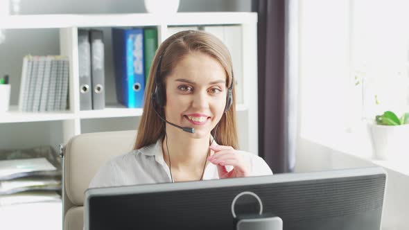 Young Woman Works at Home Office Using Computer.